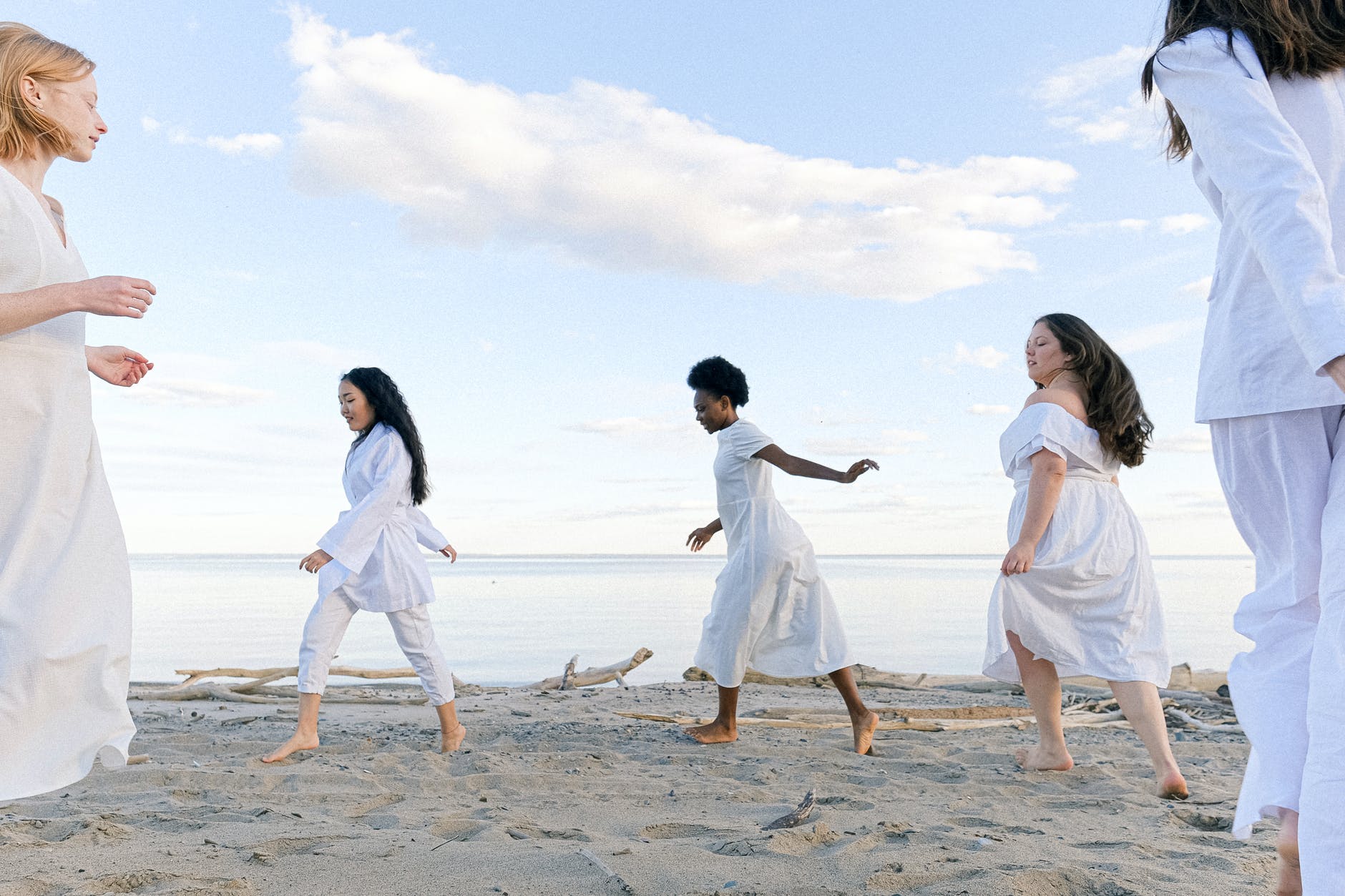 photo of women running on seaside